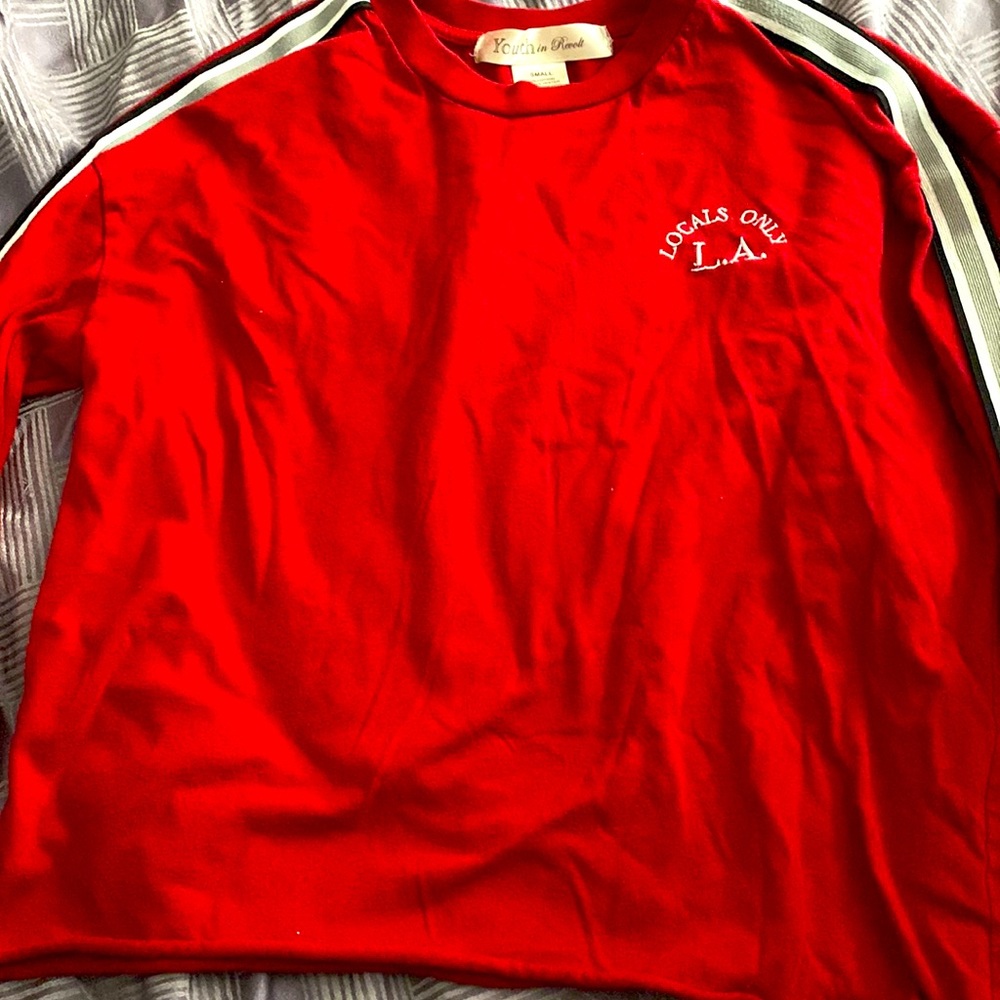 This is a cropped shirt.